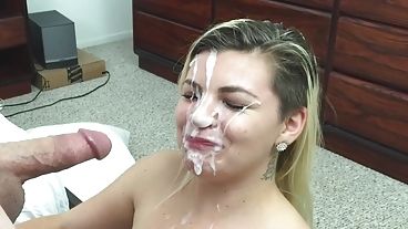 Pretty girl with an awesome hairdo gets covered in cum after a BJ